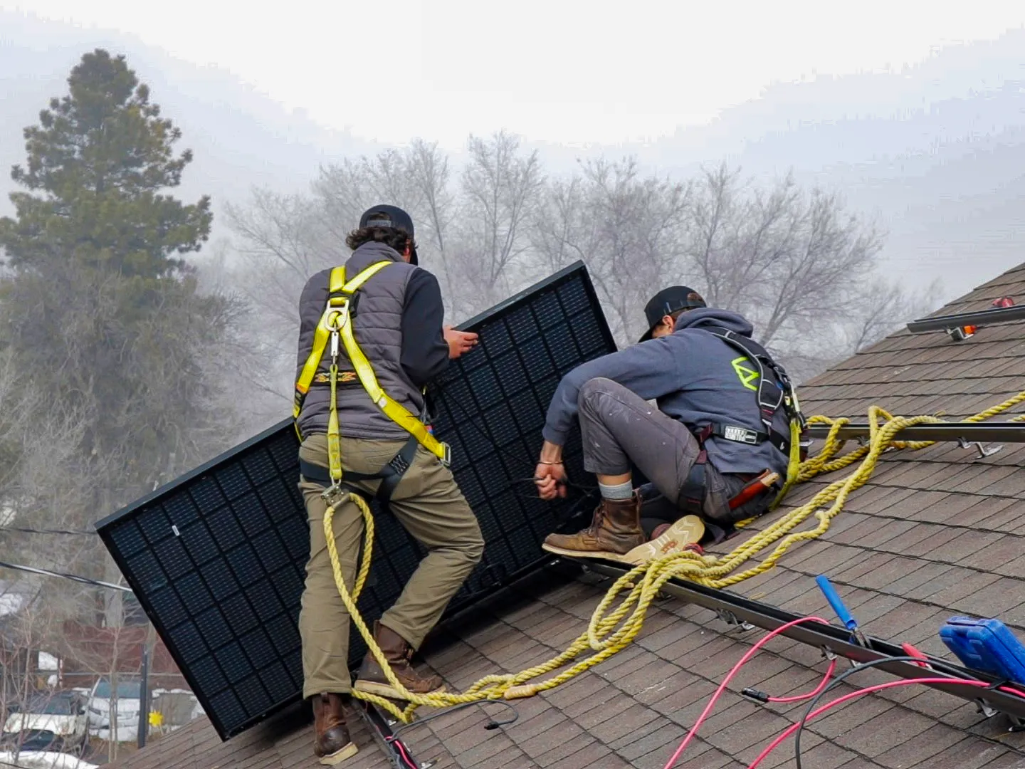 Installation crew working on a solar panel array